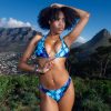 Inspired by the enchanting blue flower pattern, the Luminara swimsuit features a striking blend of deep black and vibrant blue hues.